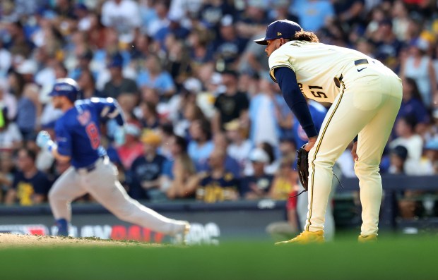 Milwaukee Brewers starting pitcher Freddy Peralta (51) watches as Chicago...