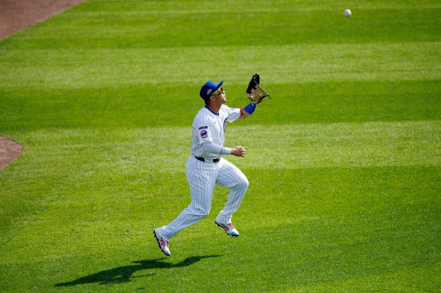 Cubs outfielder Seiya Suzuki catches a sacrifice fly from San...