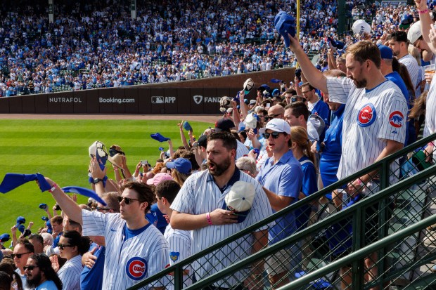 Fans cheer before the Chicago Cubs play the San Diego...