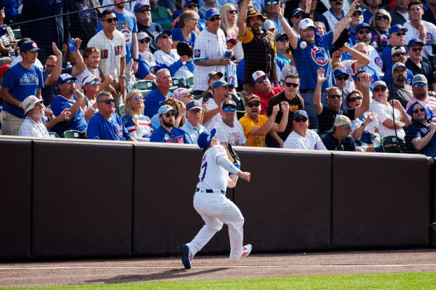 Chicago Cubs outfielder Seiya Suzuki (27) catches a ball from...