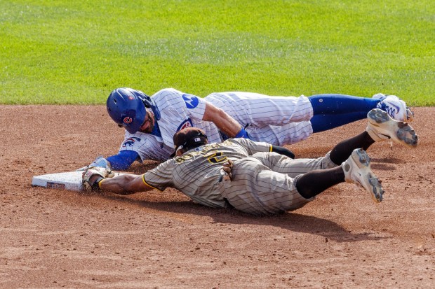 Chicago Cubs shortstop Dansby Swanson (7) dives safely to second...