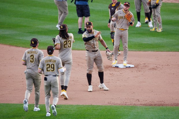 San Diego Padres players celebrate after defeating the Chicago Cubs,...