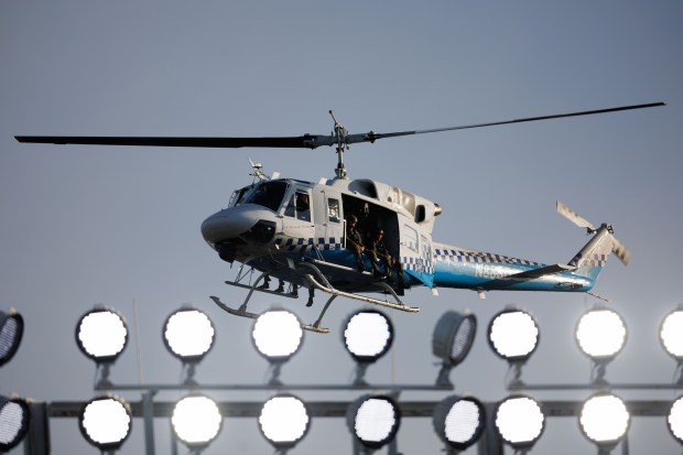 A Chicago police helicopter flies over Wrigley Field after the...