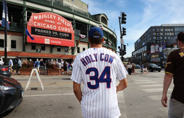 Fans arrive at Wrigley Field in Chicago before Game 2 of the NL wild-card series between the Cubs and the Padres on Oct. 1, 2025. (Chris Sweda/Chicago Tribune)