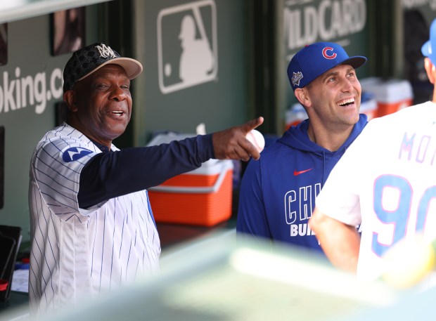 Chicago Cubs great Andre Dawson, left, has a laugh with...