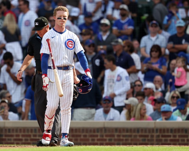 Chicago Cubs center fielder Pete Crow-Armstrong (4) throws his bat...