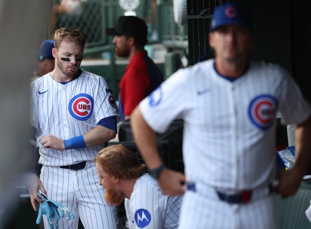 Ian Happ walks through the dugout after flying out in the ninth inning of Game 2 of the NL wild-card series against the Padres at Wrigley Field on Oct. 1, 2025. (Chris Sweda/Chicago Tribune)