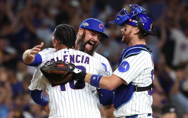 Cubs relief pitchers Andrew Kittredge, Daniel Palencia and catcher Carson...