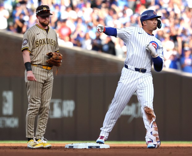 Cubs right fielder Seiya Suzuki celebrates after his double in...