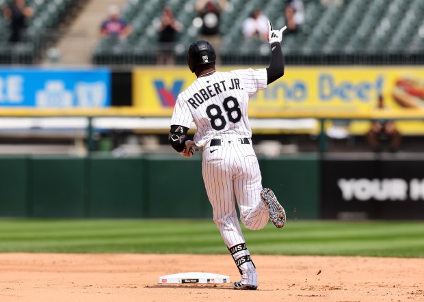 White Sox center fielder Luis Robert Jr. celebrates as he rounds the bases after hitting a two-run home run against the Guardians on July 11, 2025, at Rate Field. (Chris Sweda/Chicago Tribune)