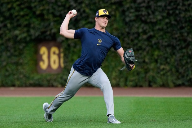 Milwaukee Brewers pitcher Quinn Priester works out during batting practice, Tuesday, Oct. 7, 2025, in Chicago, the day before Game 3 of the National League Division Series against the Chicago Cubs. (AP Photo/Nam Y. Huh)