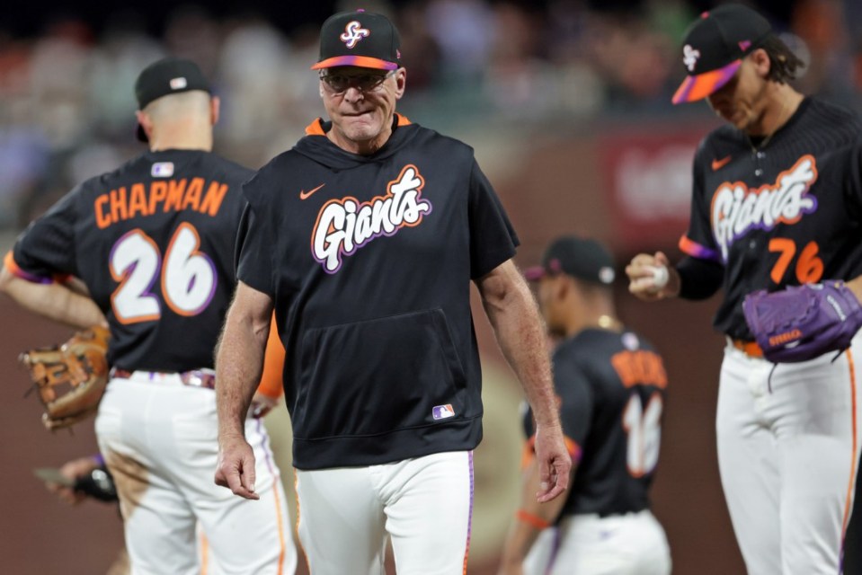 San Francisco Giants' manager Bob Melvin returns to dugout after making a 7th inning pitching change against St. Louis Cardinals during MLB game at Oracle Park in San Francisco on Tuesday, Sept. 23, 2025. (Scott Strazzante/San Francisco Chronicle via AP)