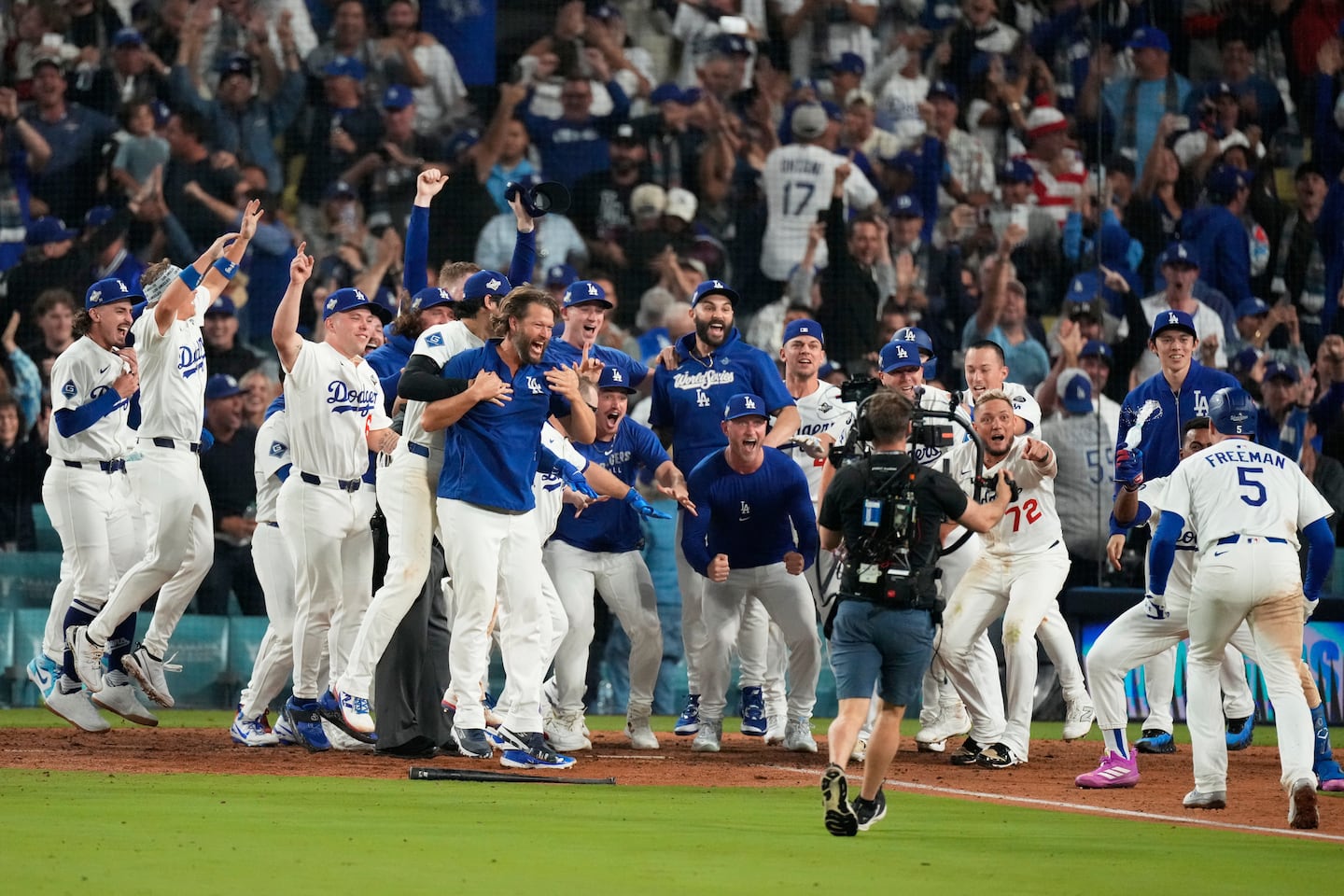 The Dodgers celebrate after Freddie Freeman's walk-off home run decided Game 3 of the World Series.