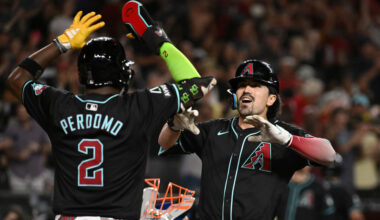 Corbin Carroll #7 of the Arizona Diamondbacks celebrates his grand slam with Geraldo Perdomo #2 aga...