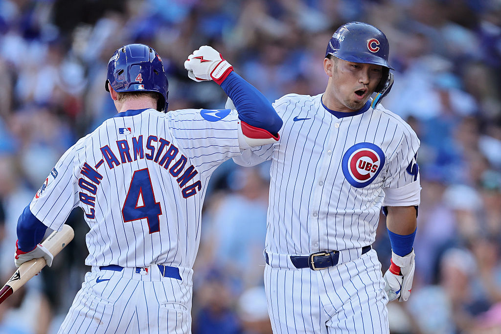 Chicago Cubs players celebrate during the MLB Wild Card Series vs. the San Diego Padres, featured in Game 2 parlay picks.