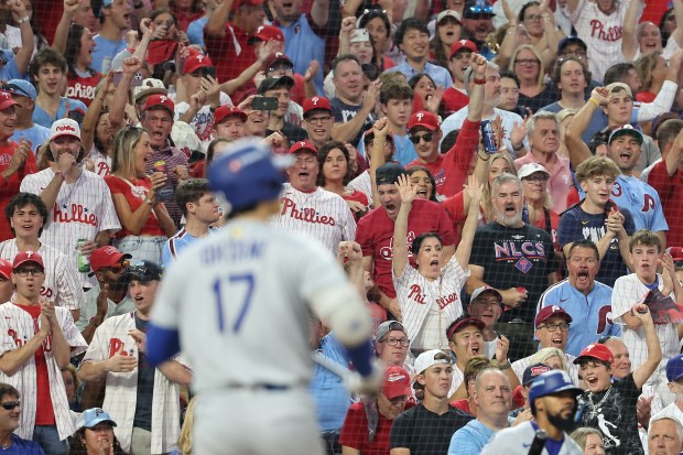 Fans cheer after Dodgers star Shohei Ohtani (17) strikes out...