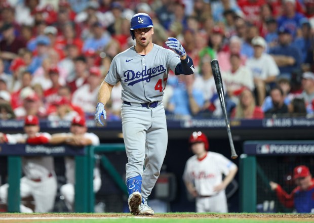 The Dodgers’ Ben Rortvedt tosses his bat after being hit...