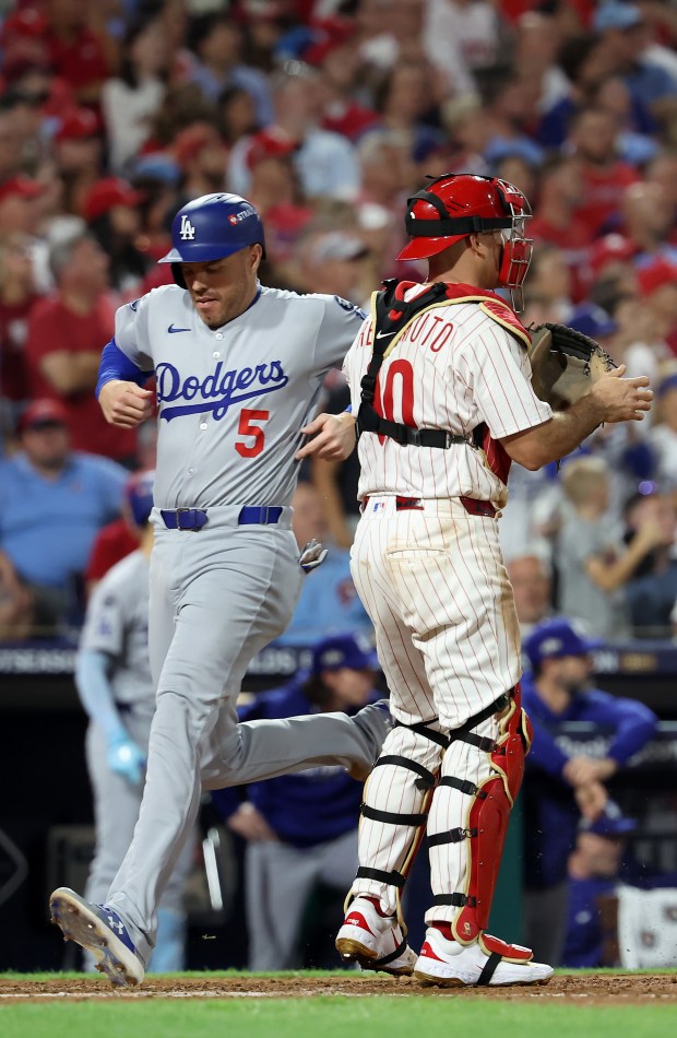The Dodgers’ Freddie Freeman scores in the sixth inning against...