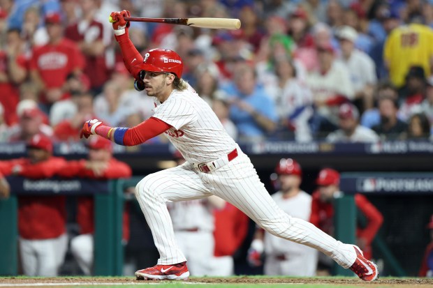 The Philadelphia Phillies’ Bryson Stott hits a single in the...