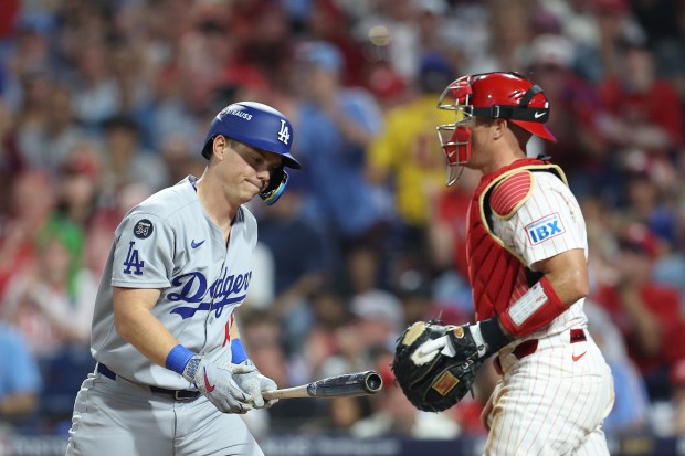 The Dodgers’ Will Smith reacts after striking out in the...