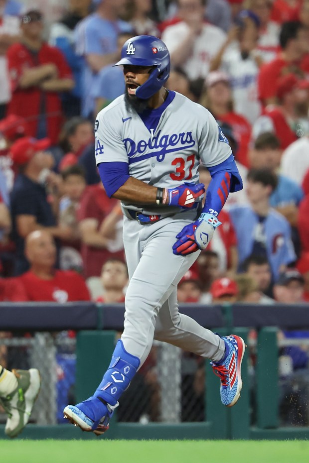 The Dodgers’ Teoscar Hernandez celebrates as he runs the bases...