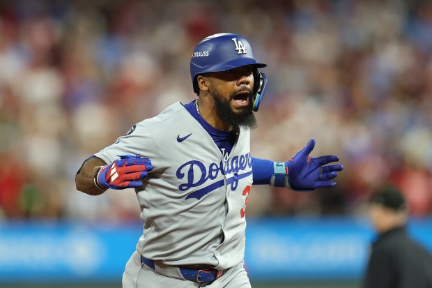 The Dodgers’ Teoscar Hernandez celebrates as he runs the bases...