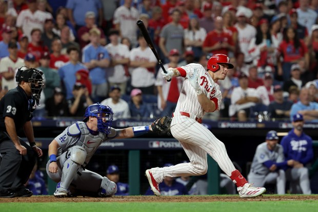 The Philadelphia Phillies’ Max Kepler hits a double in the...