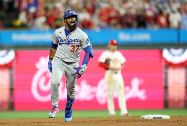 The Dodgers’ Teoscar Hernandez celebrates as he runs the bases...