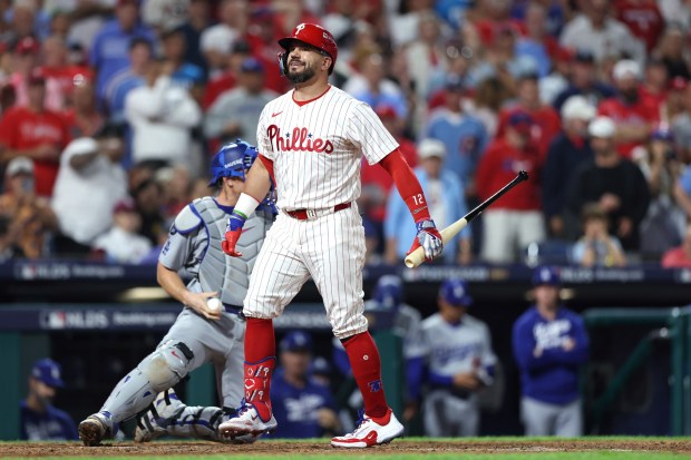 Philadelphia Phillies slugger Kyle Schwarber shows his frustration after striking out during the eighth inning of Game 2 of the National League Division Series against the Dodgers on Monday night in Philadelphia. (Photo by Emilee Chinn/Getty Images)