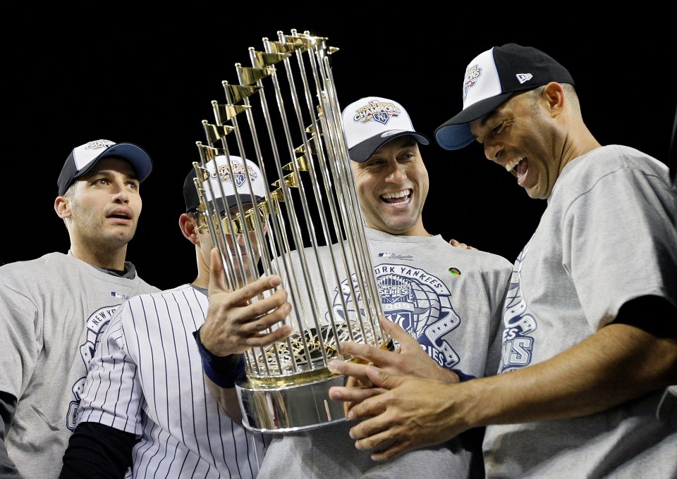 NEW YORK - NOVEMBER 04:  (L-R) Andy Pettitte #46, Jorge Posada #20, Derek Jeter #2 and Mariano Rivera #42 of the New York Yankees celebrate with the trophy after their 7-3 win against the Philadelphia Phillies in Game Six of the 2009 MLB World Series at Yankee Stadium on November 4, 2009 in the Bronx borough of New York City.  (Photo by Pool/Getty Images)