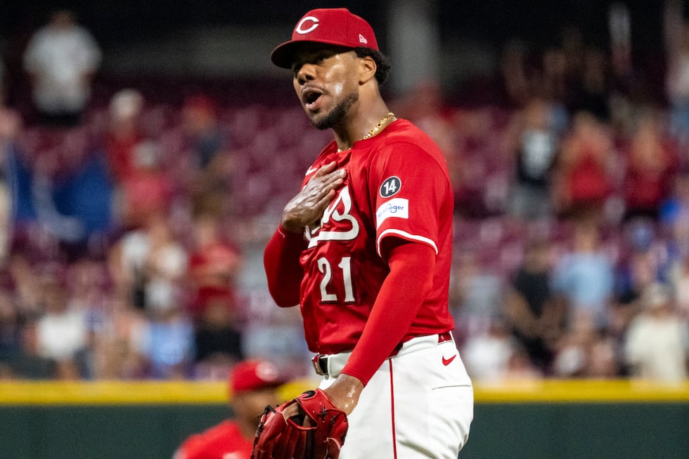Cincinnati Reds pitcher Hunter Greene reacts after striking out the last batter of a baseball...