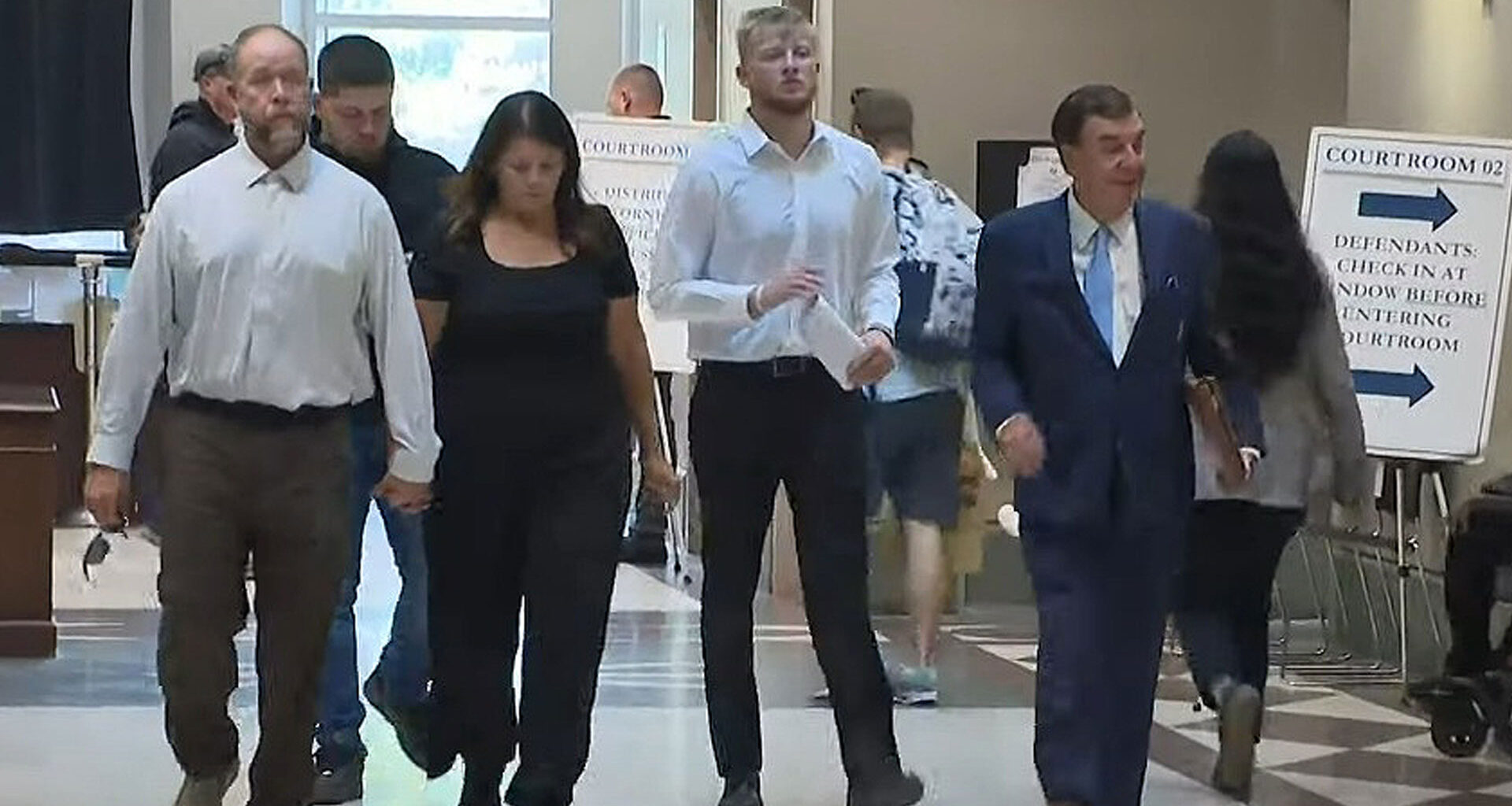 Pirates fan, 21, rushed to hospital after plunging from stands is seen in court with friend charged with his fall