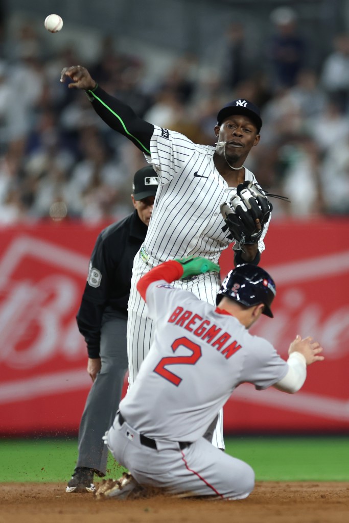Jazz Chisholm forces out Alex Bregman to complete a double play during the sixth inning of the Yankees' Game 2 win over the Red Sox. 