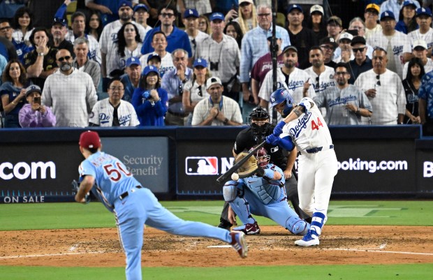 The Dodgers’ Andy Pages hits a ball back to Philadelphia...