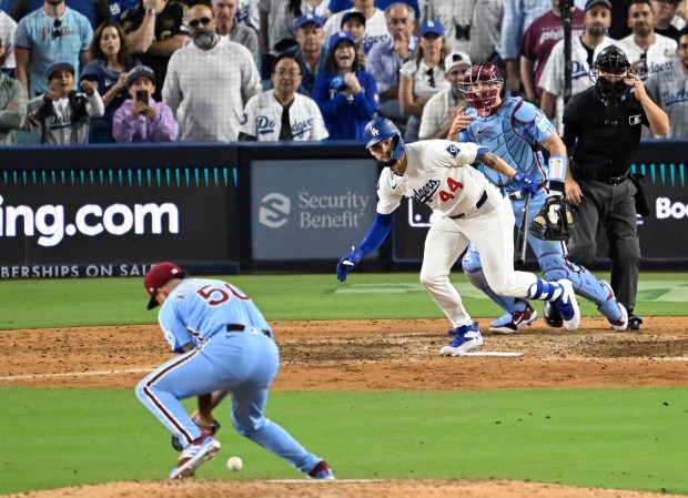 The Dodgers’ Andy Pages hits a ball back to Philadelphia...