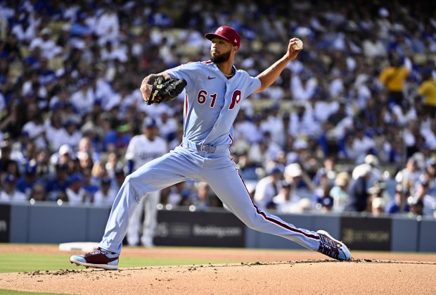 Philadelphia Phillies starting pitcher Cristopher Sanchez throws to the plate...