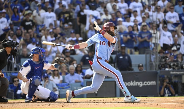 The Philadelphia Phillies’ Brandon Marsh strikes out with runners at...