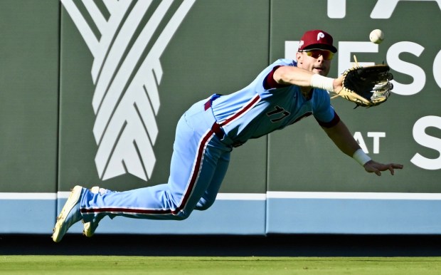 Philadelphia Phillies left fielder Max Kepler makes a diving catch...