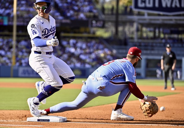 The Dodgers’ Kike Hernandez is safe at first base on...