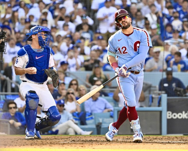 Philadelphia Phillies slugger Kyle Schwarber reacts after striking out as...