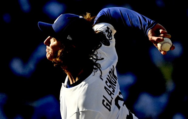 Dodgers starting pitcher Tyler Glasnow throws to the plate during...