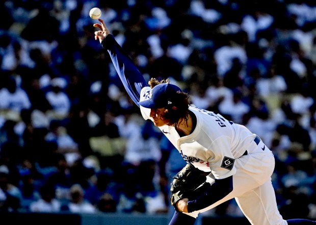 Dodgers starting pitcher Tyler Glasnow throws to the plate during...