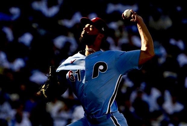 Philadelphia Phillies starting pitcher Cristopher Sanchez throws to the plate...
