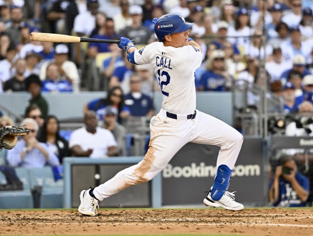 The Dodgers’ Alex Call hits a single during the fifth...
