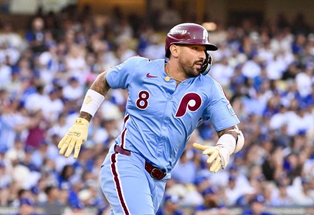 The Philadelphia Phillies’ Nick Castellanos runs after hitting an RBI...