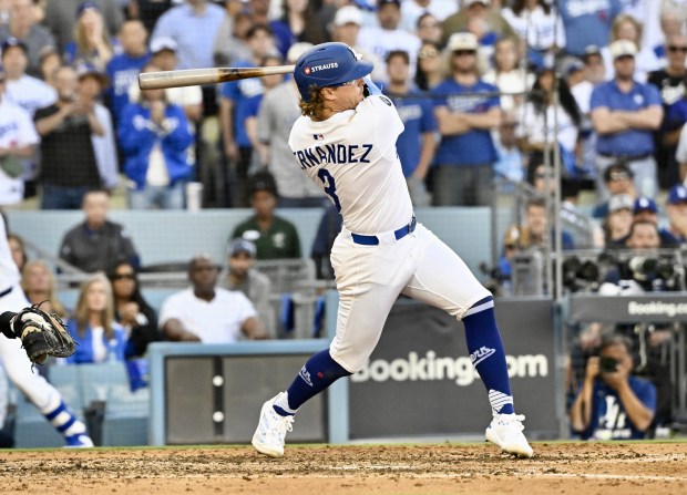 The Dodgers’ Kike Hernandez hits a single during the seventh...