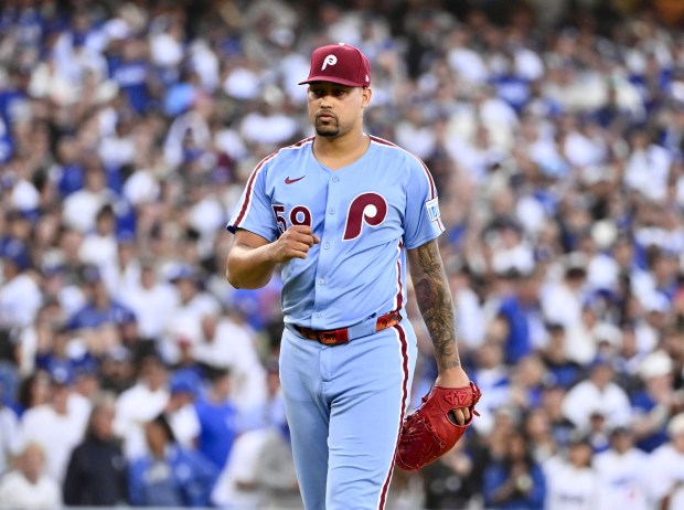 Philadelphia Phillies relief pitcher Jhoan Duran reacts after striking out...