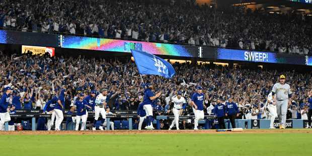 Los Angeles Dodgers celebrate after defeating the Milwaukee Brewers 5-1...