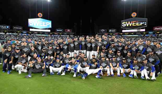 Los Angeles Dodgers pose for the team photo after defeating...