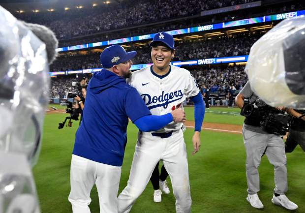 Shohei Ohtani #17 of the Los Angeles Dodgers celebrates after...